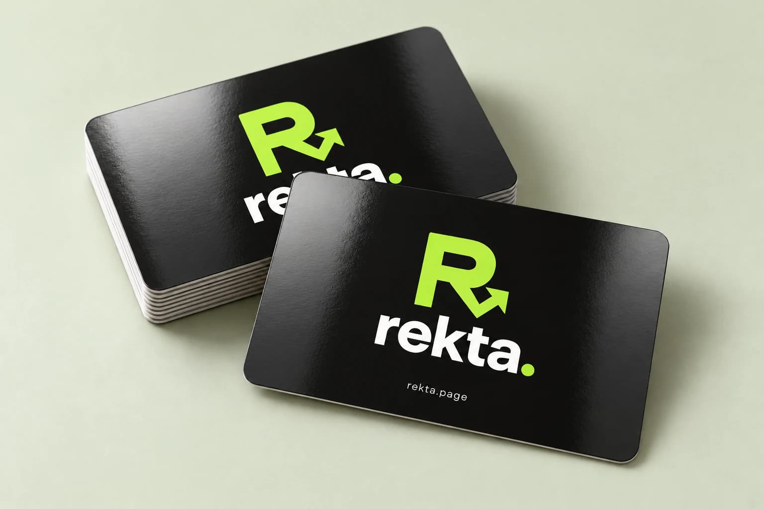 Illustrative glossy charcoal Rekta cards with light reflecting across the surface.